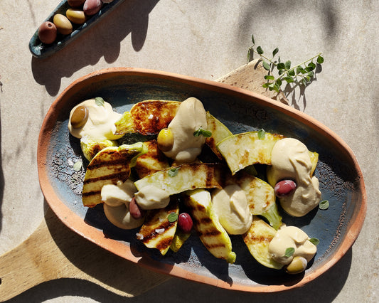 Zucchine trombetta con salsa tonnata maggiorana finger lime